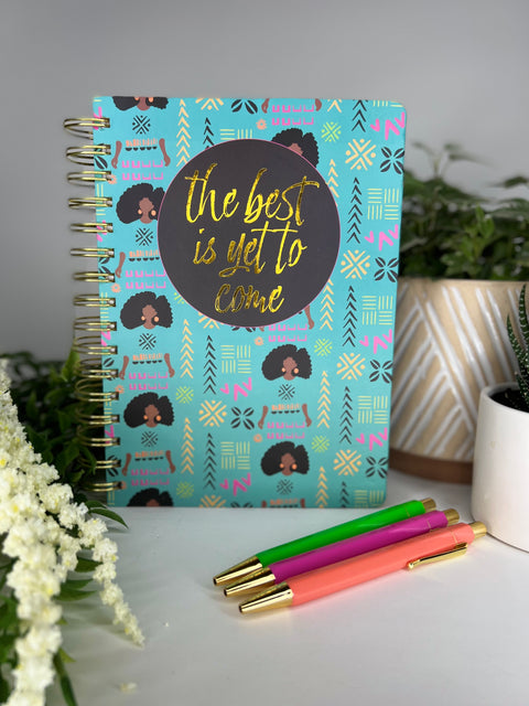 Teal spiral bound notebook with trendy African American girl patterned cover and 3 colorful ballpoint pens