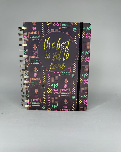 Black spiral bound notebook with trendy African American girl patterned cover with elastic band closure